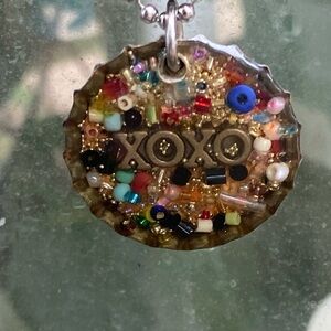 Bottle cap necklace with “xoxo” 13.5” silver chain